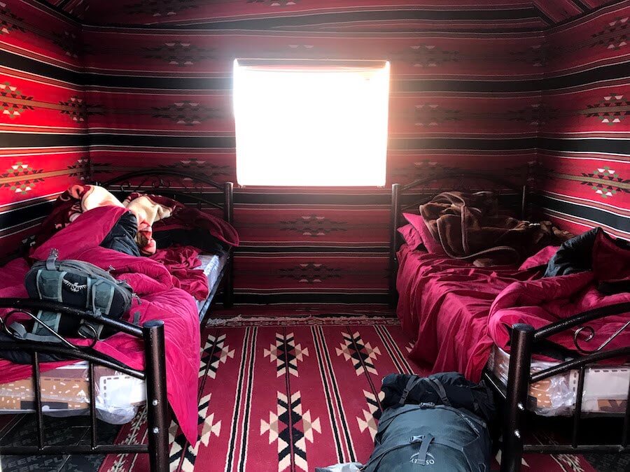 backpacker - two beds inside of carpeted tent in wadi rum desert