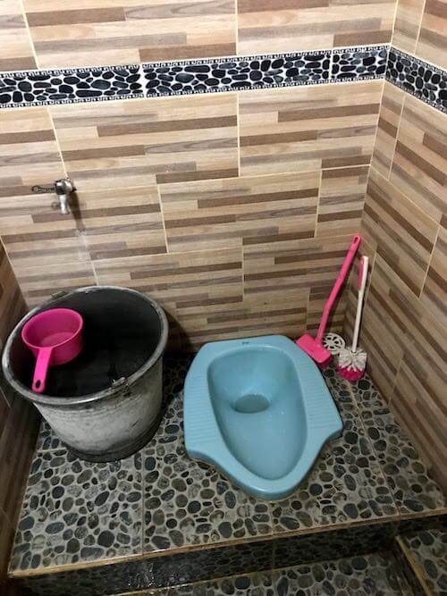 solo vacation - asian style toilet in the ground in nusa penida island