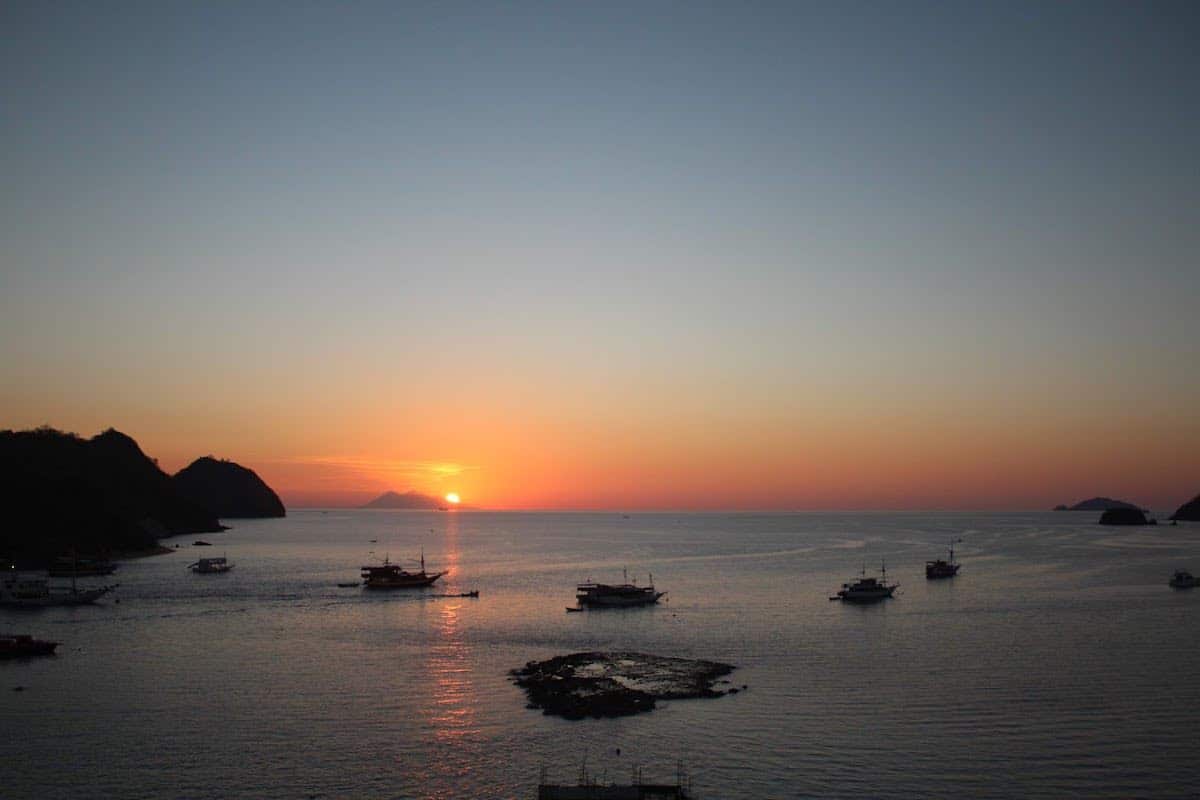 solo vacation - sunset overlooking the harbor in flores