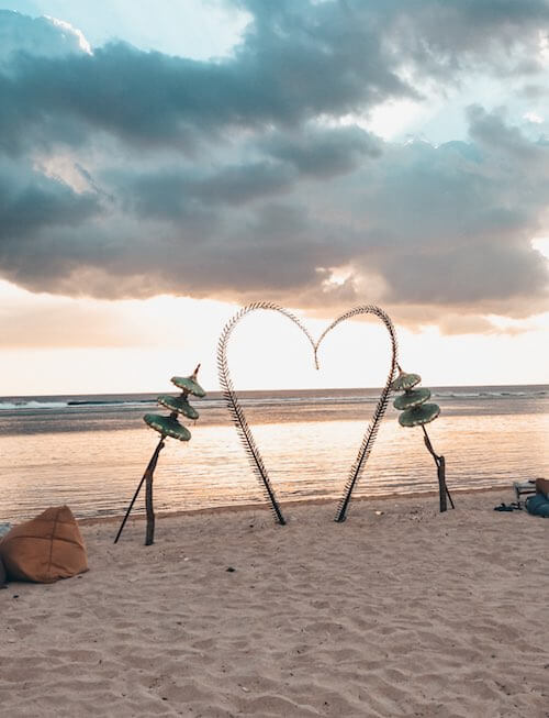solo vacation - romantic heart structure in sand of beach in gili islands