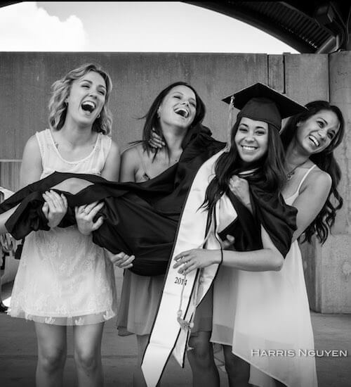 travel the world - group of girls holding another girl in her graduation cap and gown