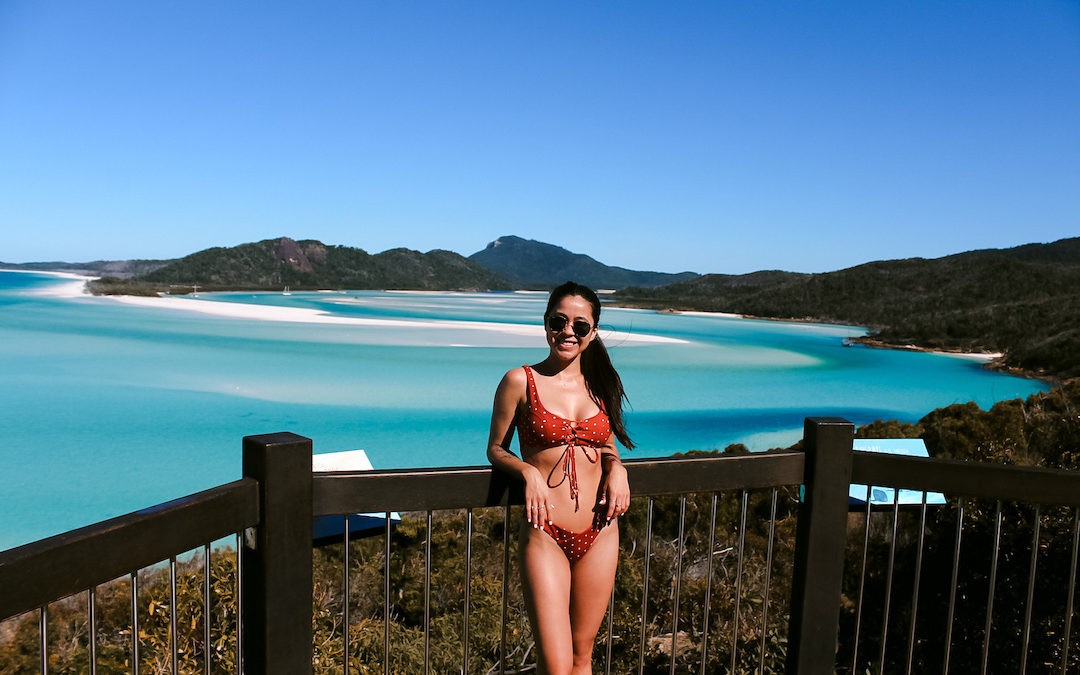girl posing in front of whitsundays in australia